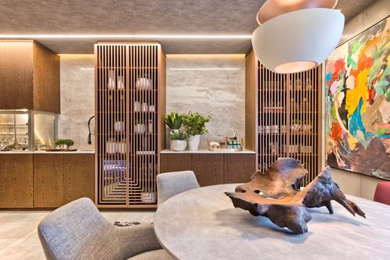 Sala de Almoço - Samara Barbosa. A madeira natural combinada ao mármore e ao concreto proporcionam uma sensação moderna e sofisticada ao ambiente, perfeito para receber.