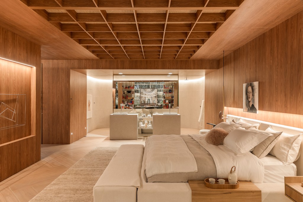 Painéis amadeirados criam conforto e aconchego neste loft de 270 m²